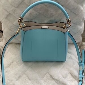 New, fresh out the package, never used Kate Spade bag.